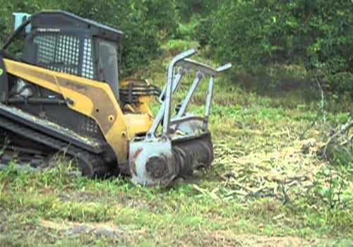 What is the best equipment to clear land?